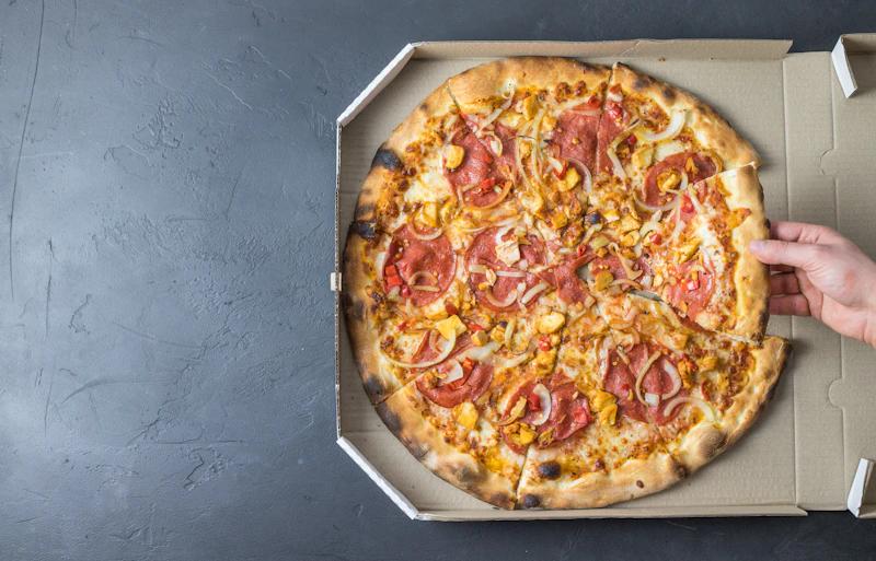 Pizza on a white cardboard pizza box