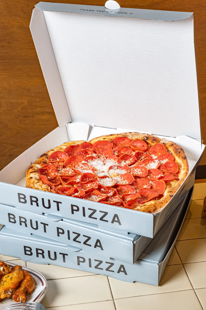 Pizza inside a printed pizza box